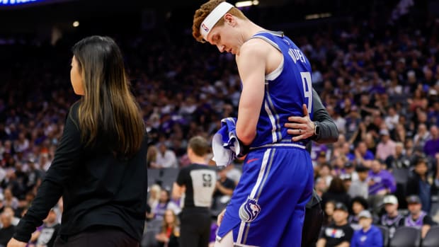 Mar 18, 2024; Sacramento, California, USA; Sacramento Kings guard Kevin Huerter (9) suffers an injury during the first quarter against the Memphis Grizzlies at Golden 1 Center. Mandatory Credit: Sergio Estrada-USA TODAY Sports